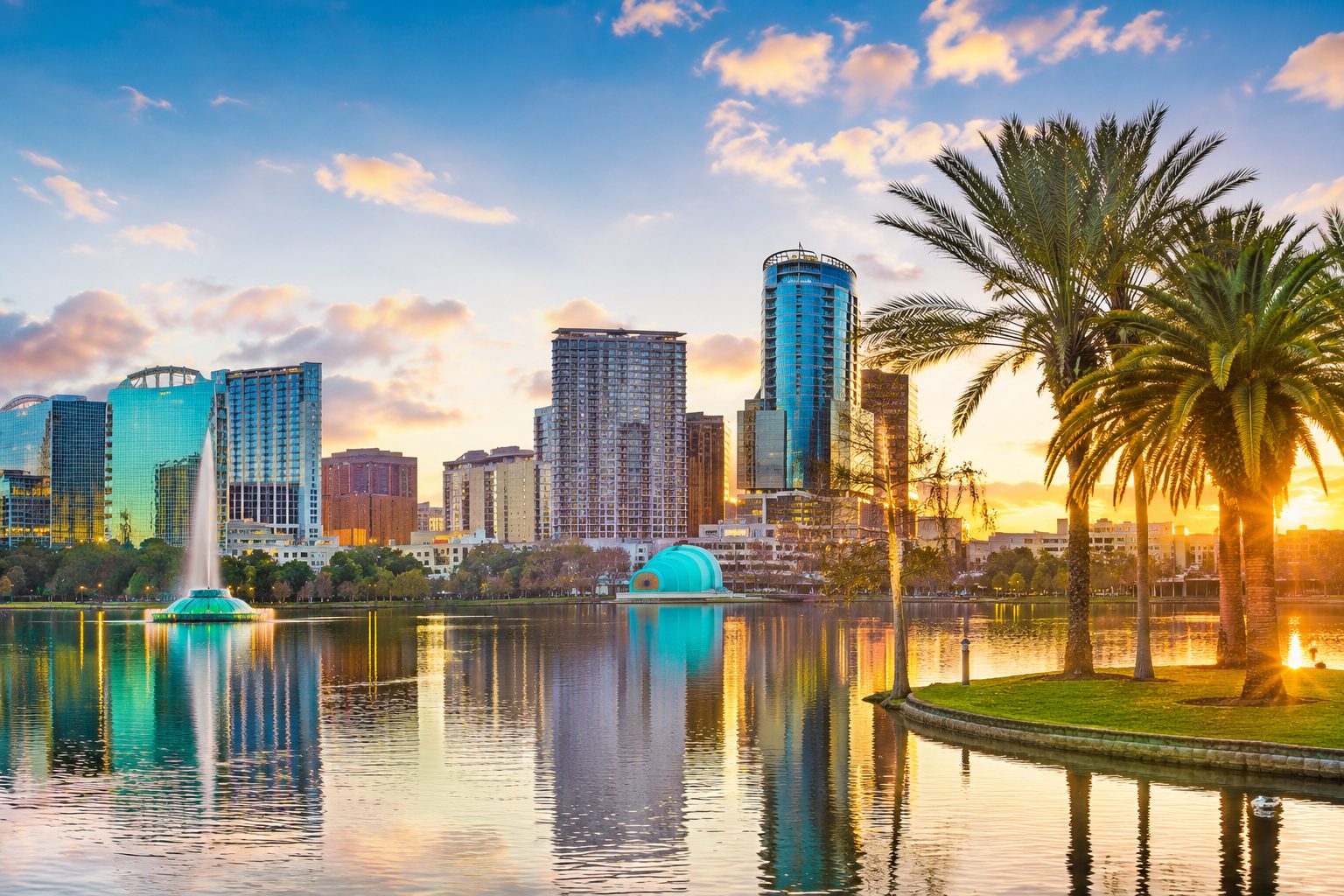 Orlando skyline at sunset overlooking Lake Eola, representing the Central Florida housing market after the Federal Reserve's rate decision.
